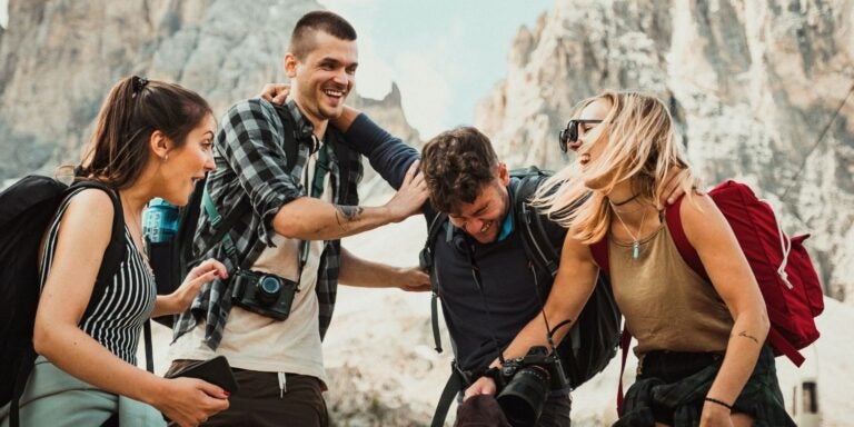 Friends laughing on a mountain
