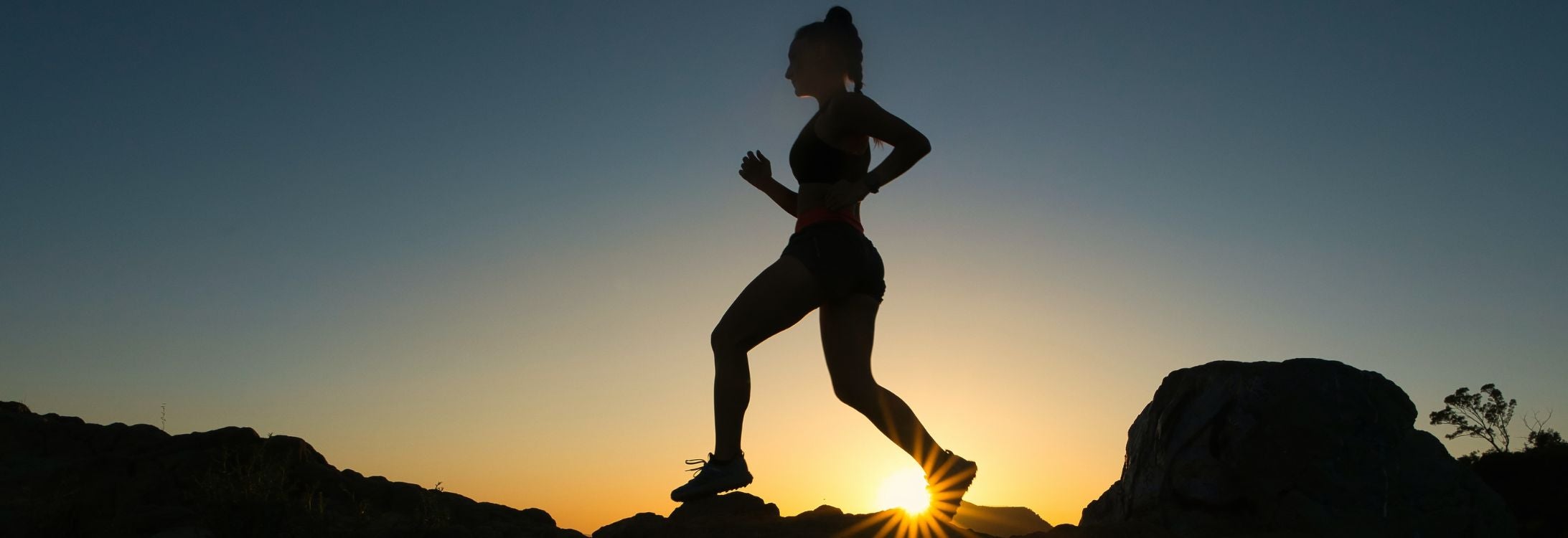 Woman running with sunset - Running for Recovery blog cover