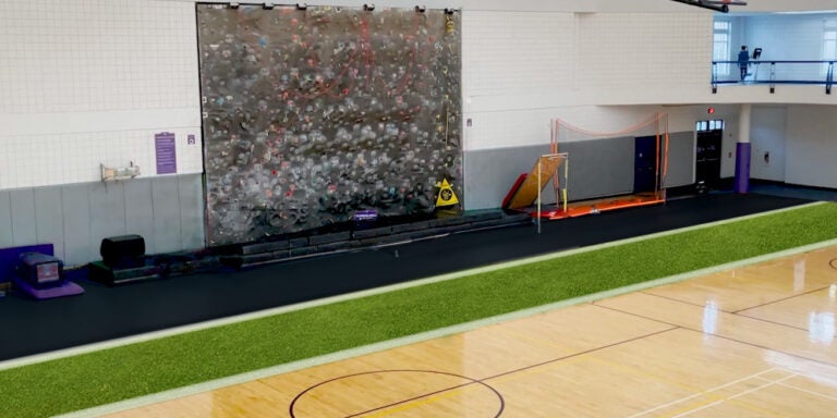 Mockup of new court with turf and rubber flooring